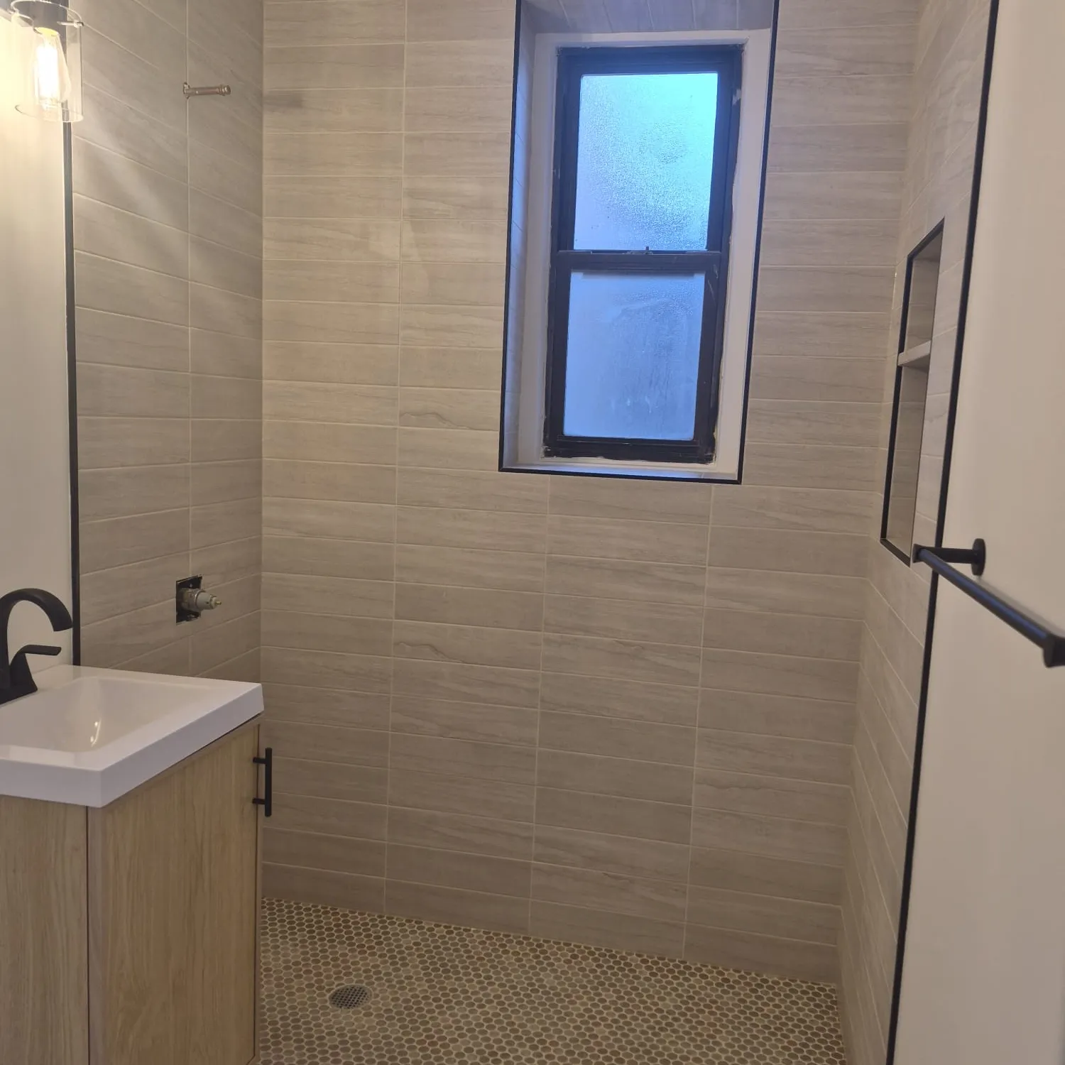 Pre-war Manhattan master bath — Calacatta slab vanity, mitred shower walls