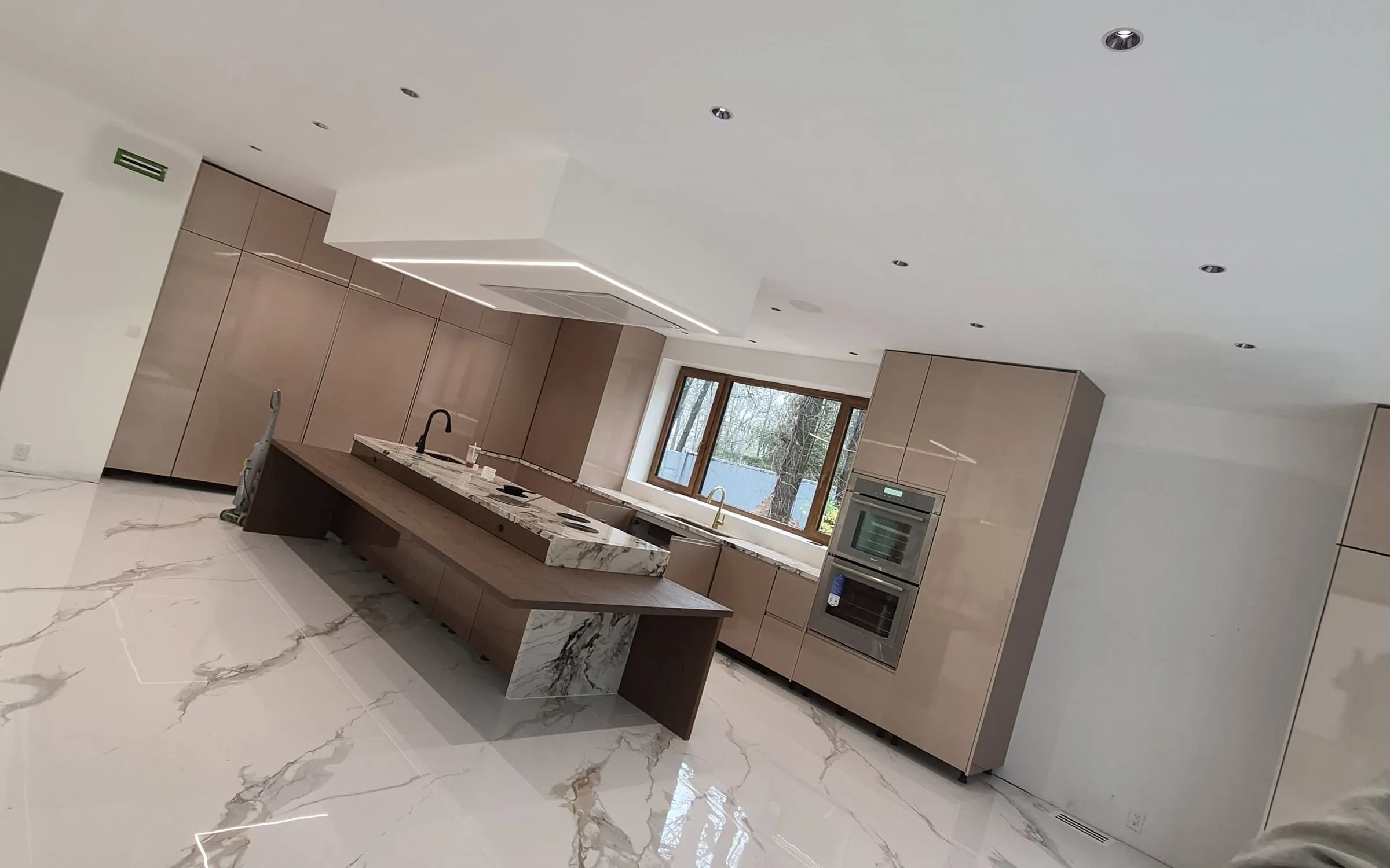 Queens kitchen renovation with custom cabinetry and marble waterfall island